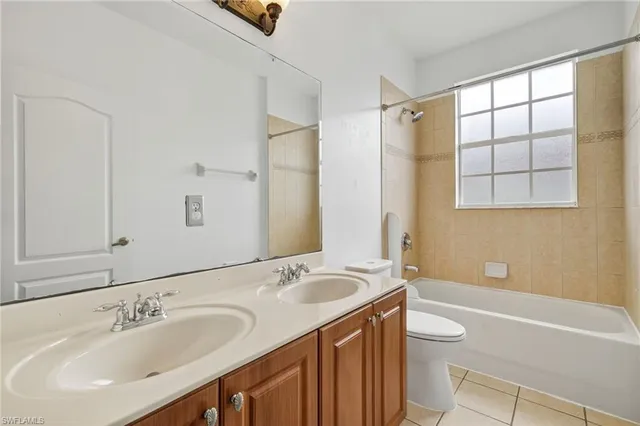 a bathroom with a sink toilet tub and shower