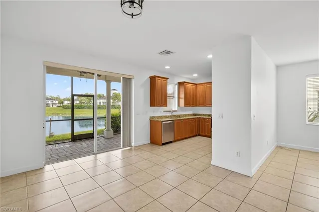 a kitchen with a sink a counter top space and appliances