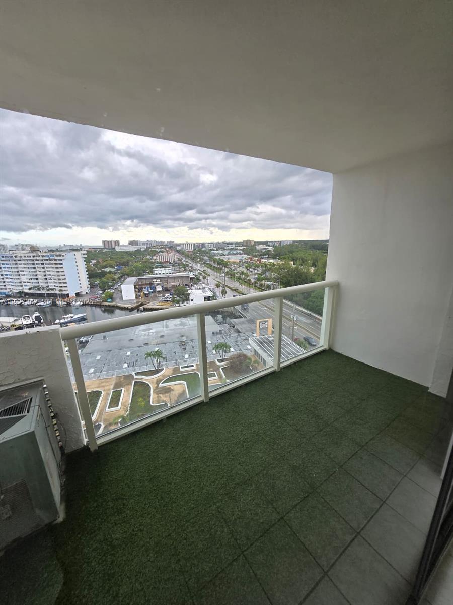 13499 Biscayne Boulevard, Unit 1204 North Miami, FL 33181 - Photo 13 of 13 a view of a kitchen with an outdoor space