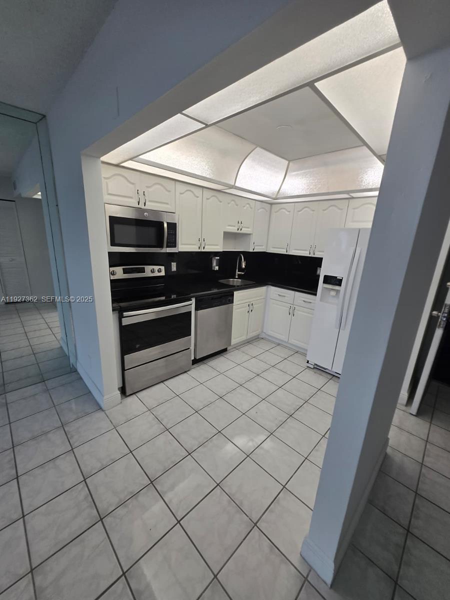 13499 Biscayne Boulevard, Unit 1204 North Miami, FL 33181 - Photo 4 of 13 a room with storage and utility