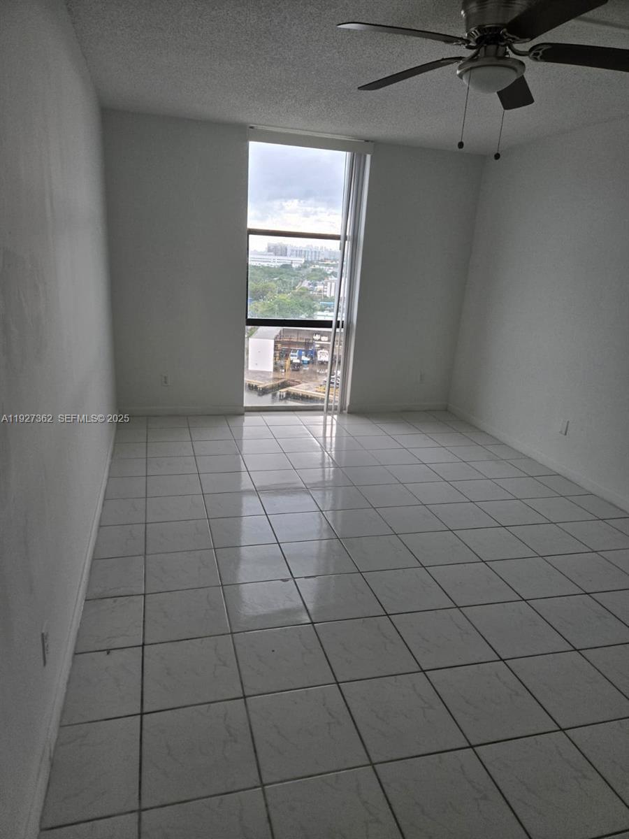 13499 Biscayne Boulevard, Unit 1204 North Miami, FL 33181 - Photo 5 of 13 a view of an empty room and a window