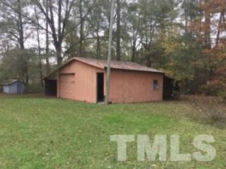 216 New Creech Road Selma, NC 27576 - Photo 14 of 14 a backyard of a house with lots of green space
