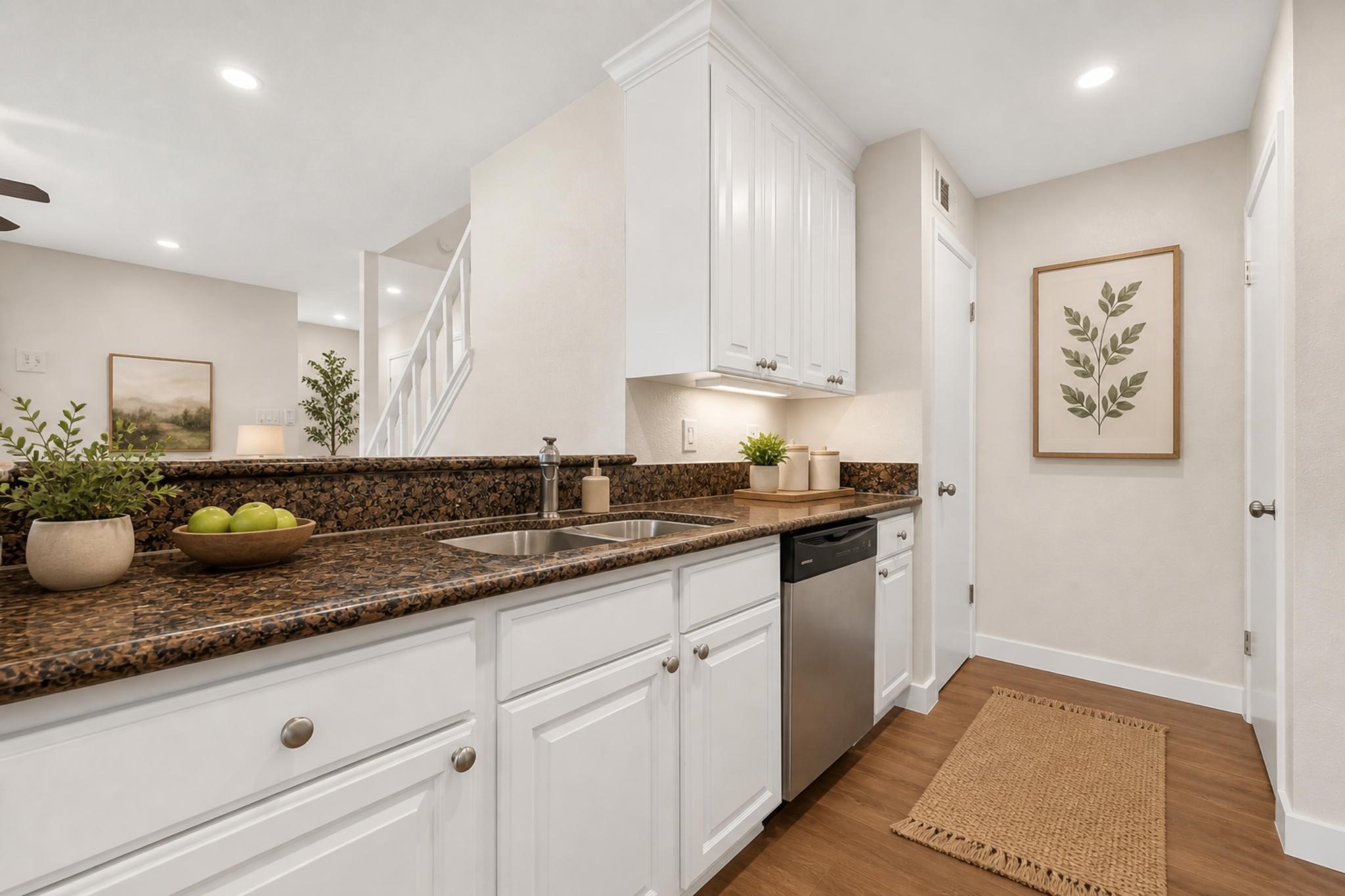 2211 South Kirkwood Road, Unit 68 Houston, TX 77077 - Photo 8 of 14 “Bright, updated kitchen featuring granite countertops, white cabinetry, stainless steel appliances, and a clean, modern look.”
