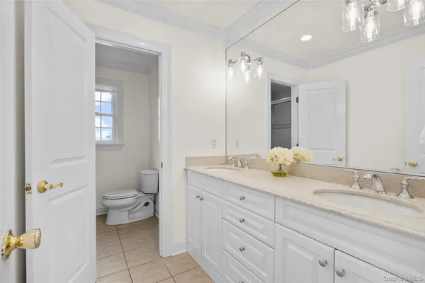a bathroom with a sink a vanity and a mirror