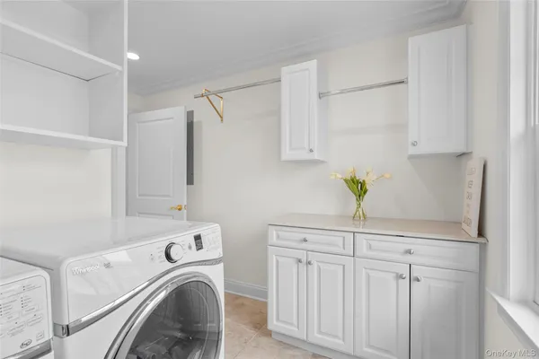 a view of storage and utility room with washer and dryer