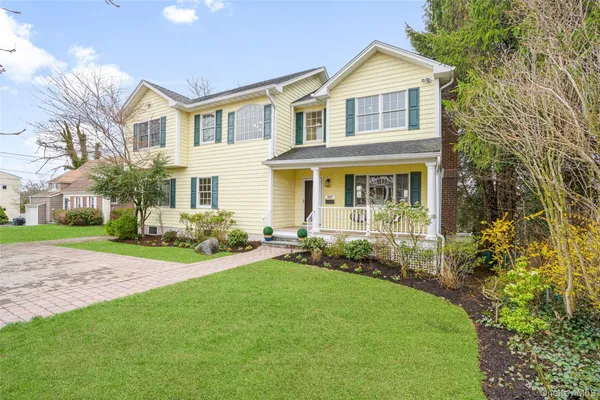 front view of a house with a yard