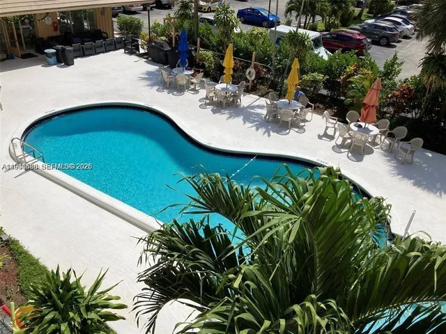 a view of a swimming pool with a patio