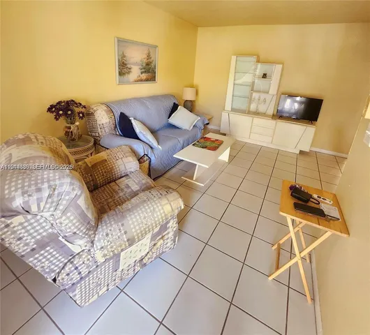 a living room with a couch and a rug