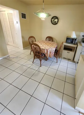 a bedroom with furniture and a fan