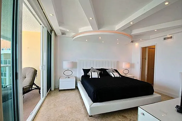 a bathroom with a granite countertop toilet a sink and a mirror