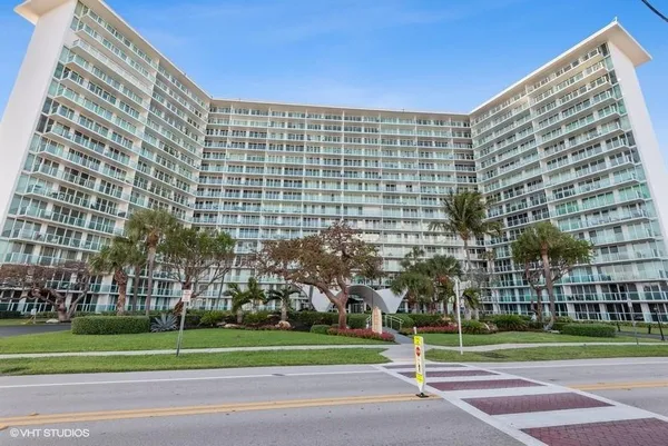 a swimming pool with outdoor seating and yard