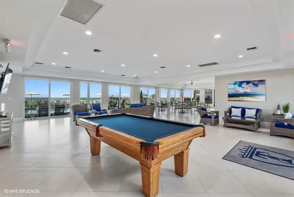 a view of a swimming pool and lounge chairs