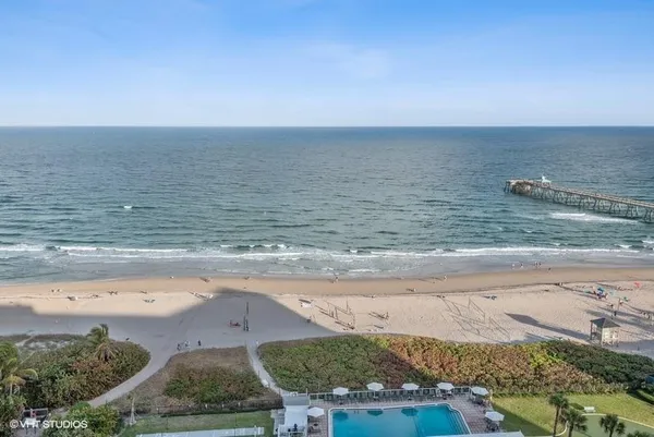 a view of swimming pool with outdoor seating