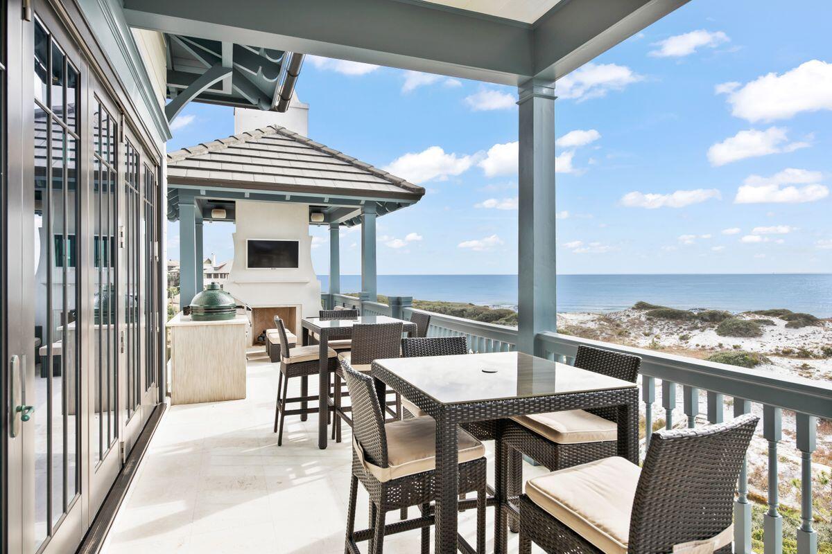 243 West Bermuda Drive Santa Rosa Beach, FL 32459 - Photo 13 of 37 a view of a patio with a table and chairs