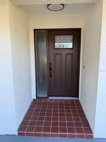 wooden floor in an empty room with a fireplace