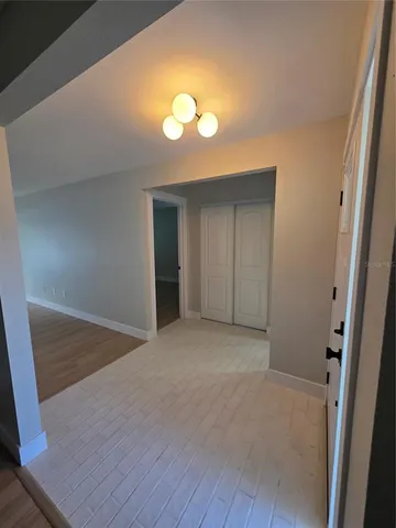 a living room with fireplace furniture and a wooden floor