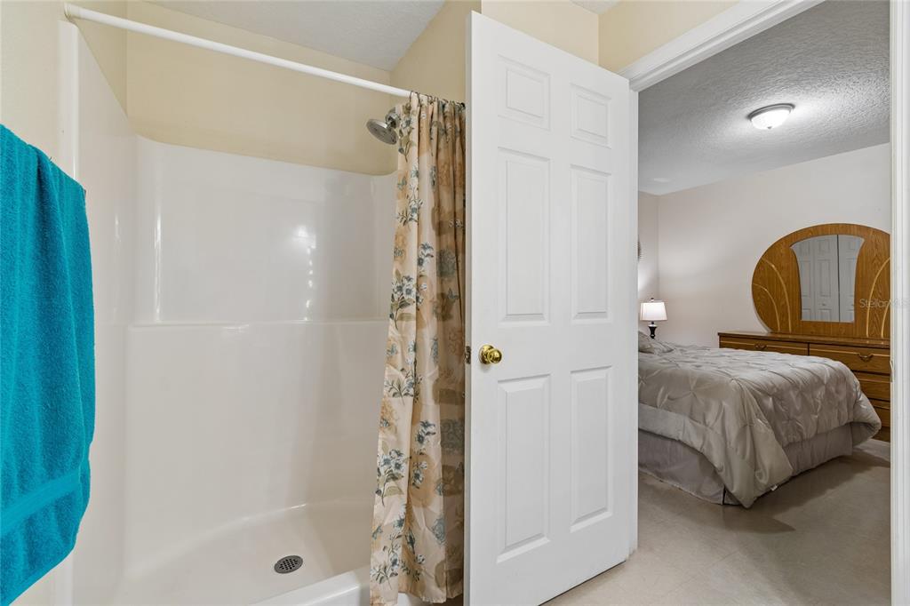 468 North Wheeler Avenue Inverness, FL 34453 - Photo 19 of 24 a bedroom with a bed and a shower