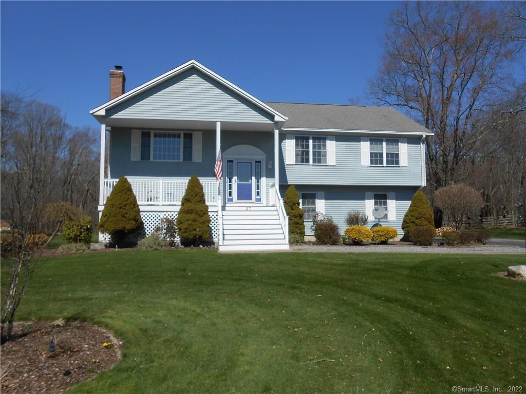 27 Miller Farm Road Coventry, CT 06238 - Photo 1 of 1 a front view of a house with garden and porch
