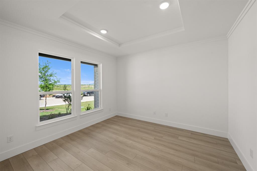 3714 Milwaukee Avenue Midlothian, TX 76065 - Photo 13 of 40 wooden floor in an empty room with a window
