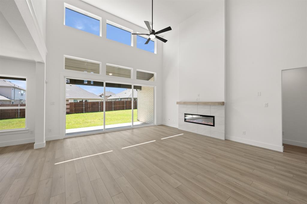 3714 Milwaukee Avenue Midlothian, TX 76065 - Photo 18 of 40 a view of an empty room with a window and wooden floor