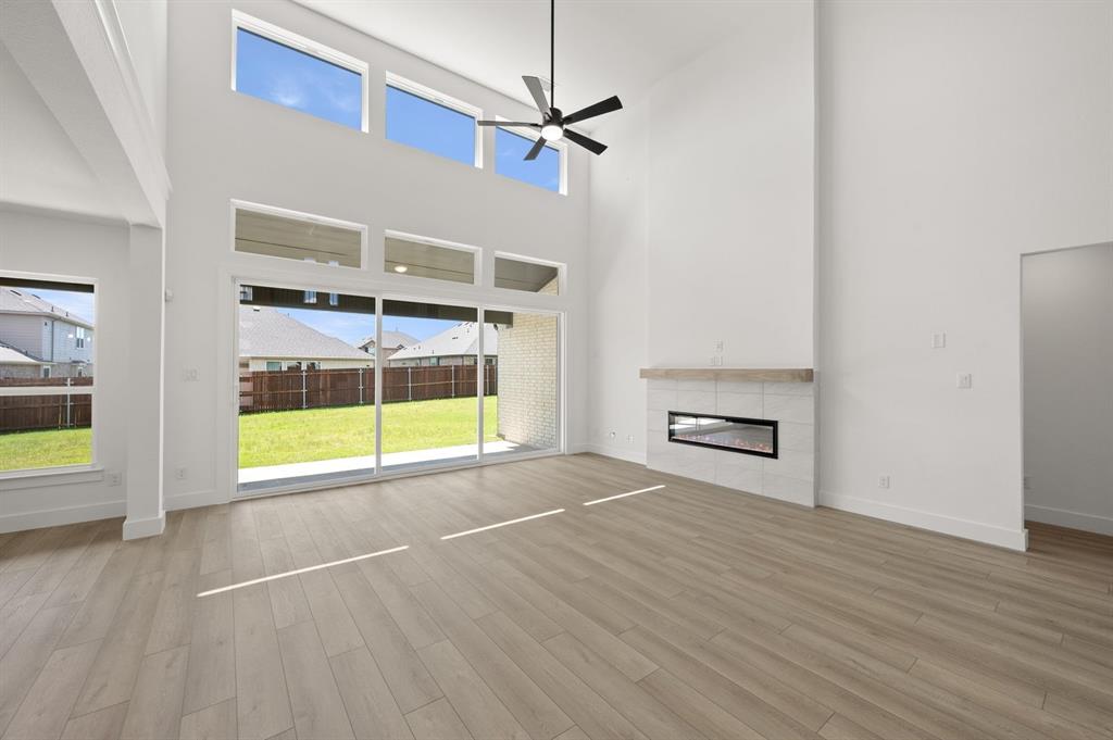 3714 Milwaukee Avenue Midlothian, TX 76065 - Photo 21 of 40 a view of an empty room with a window and wooden floor