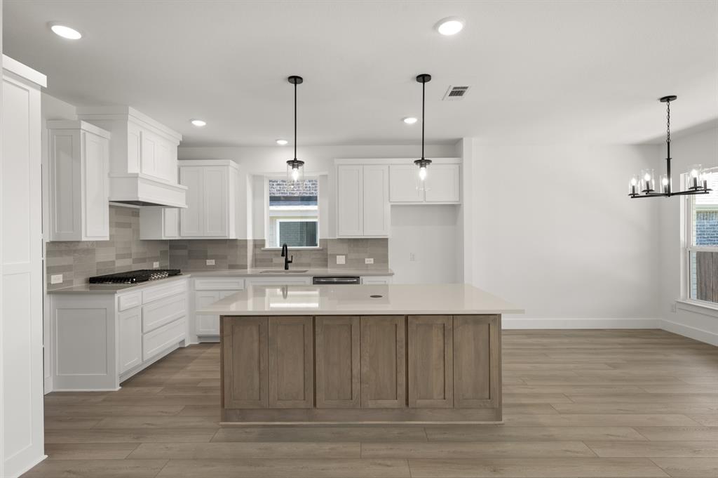 3714 Milwaukee Avenue Midlothian, TX 76065 - Photo 24 of 40 a kitchen with a sink stainless steel appliances and cabinets