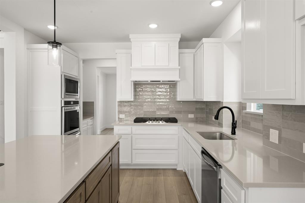 3714 Milwaukee Avenue Midlothian, TX 76065 - Photo 25 of 40 a kitchen with a sink stainless steel appliances and cabinets