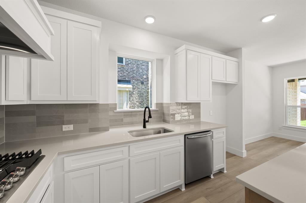 3714 Milwaukee Avenue Midlothian, TX 76065 - Photo 27 of 40 a kitchen with a sink cabinets and window