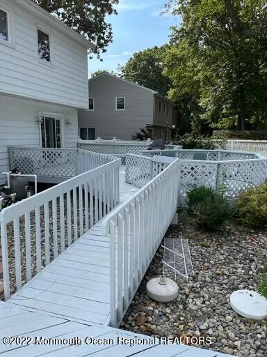 104 Pear Street, Unit WINTER Oakhurst, NJ 07755 - Photo 17 of 17 a view of house with backyard and furniture