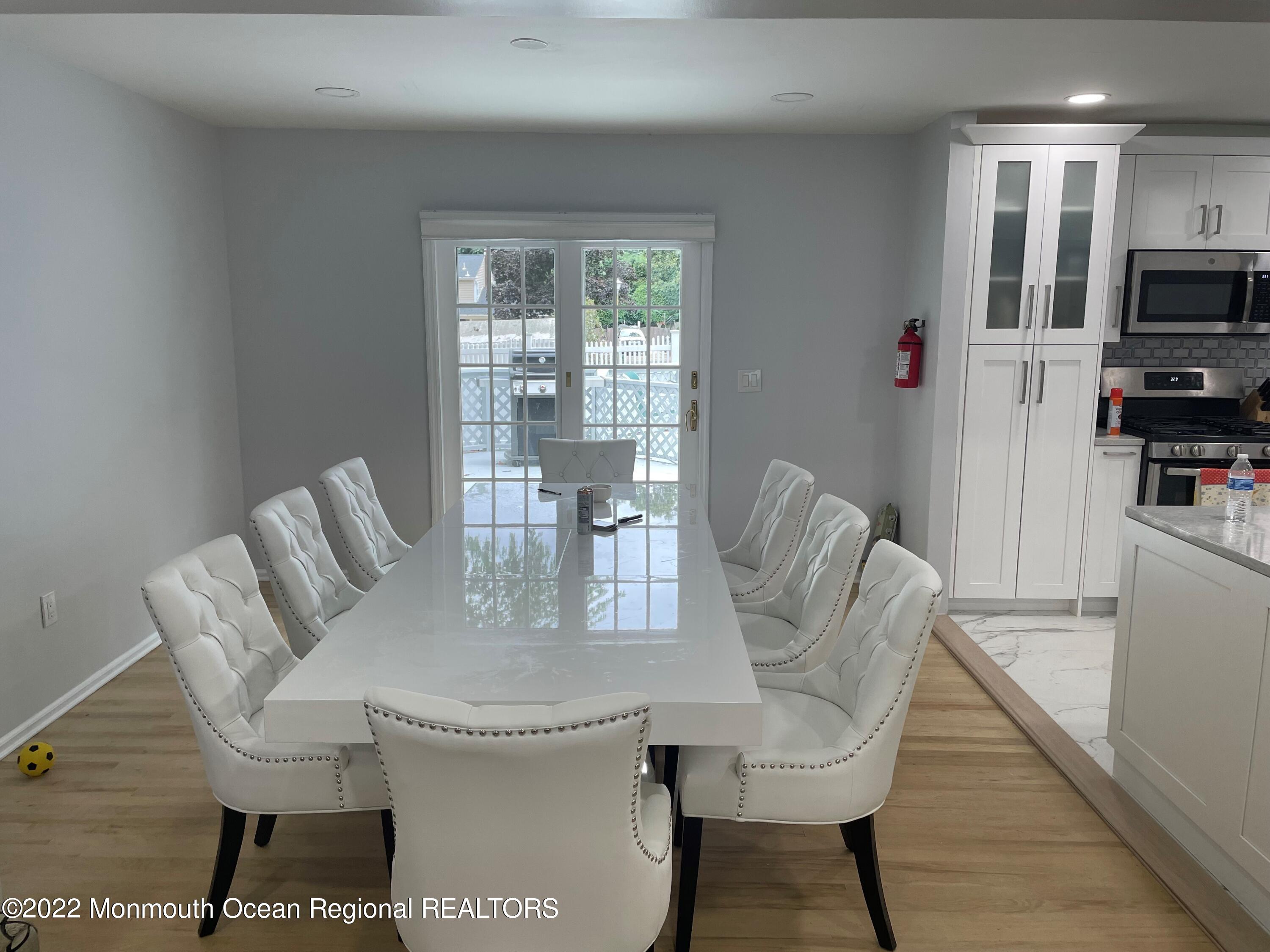 104 Pear Street, Unit WINTER Oakhurst, NJ 07755 - Photo 6 of 17 a view of a dining room with furniture