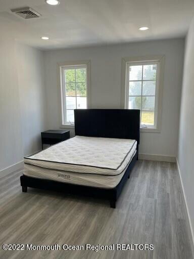 104 Pear Street, Unit WINTER Oakhurst, NJ 07755 - Photo 9 of 17 a bedroom with a bed and window