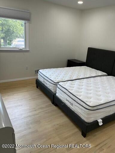 104 Pear Street, Unit WINTER Oakhurst, NJ 07755 - Photo 10 of 17 a bedroom with a bed and a window