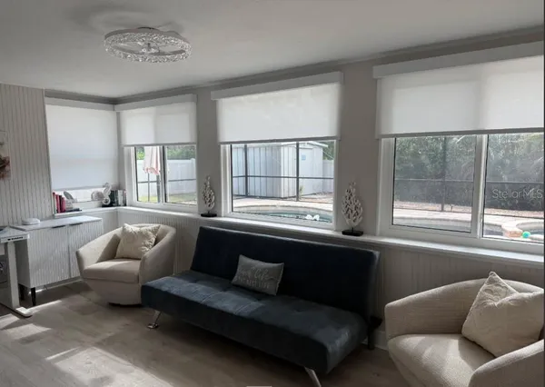 a living room with furniture and a window