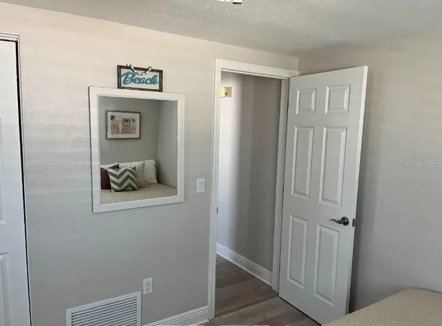 a view of a hallway with closet