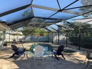 a patio with table and chairs