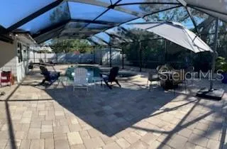 a view of a backyard with sitting area