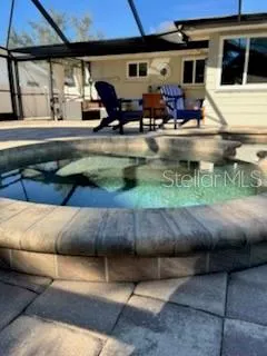 a view of swimming pool with outdoor seating