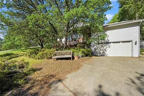 a pathway of a house with a yard
