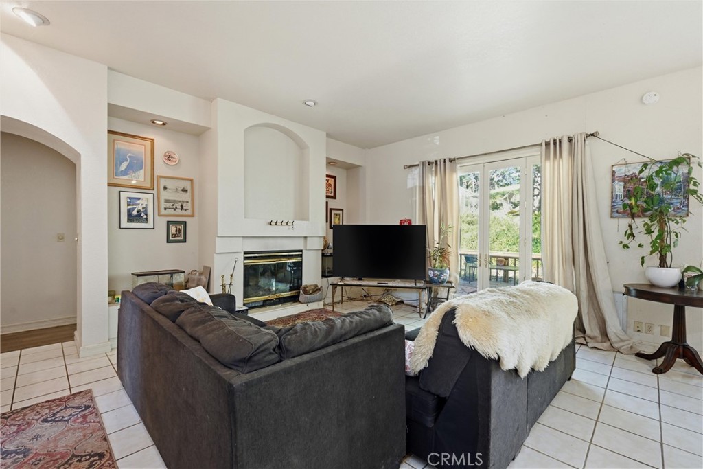 19552 Powder Horn Road Hidden Valley Lake, CA 95467 - Photo 12 of 30 a living room with furniture a fireplace and a flat screen tv