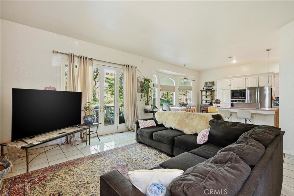 19552 Powder Horn Road Hidden Valley Lake, CA 95467 - Photo 13 of 30 a living room with furniture and a flat screen tv