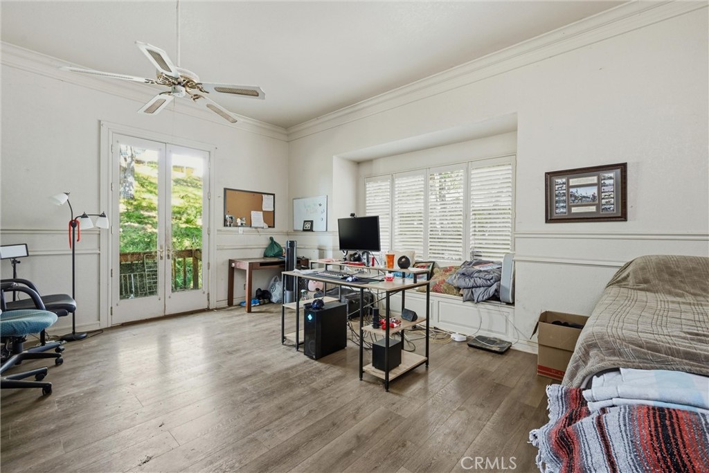 19552 Powder Horn Road Hidden Valley Lake, CA 95467 - Photo 15 of 30 a living room with furniture floor to ceiling window and a flat screen tv