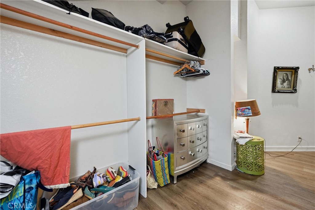 19552 Powder Horn Road Hidden Valley Lake, CA 95467 - Photo 19 of 30 a bedroom with a bed and wooden floor