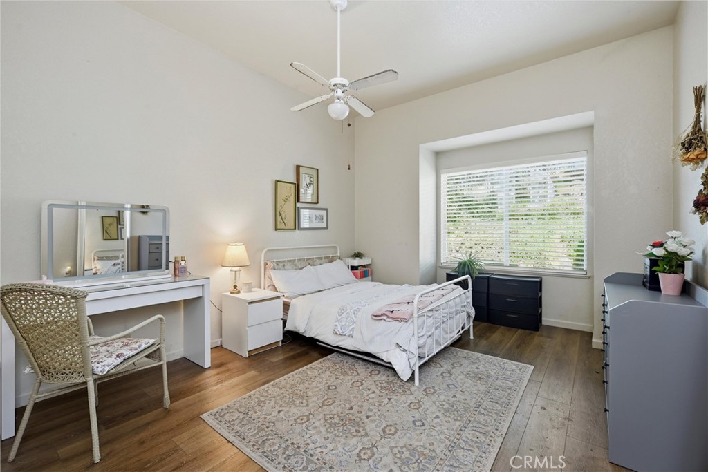 19552 Powder Horn Road Hidden Valley Lake, CA 95467 - Photo 20 of 30 a bedroom with a bed and a table in it