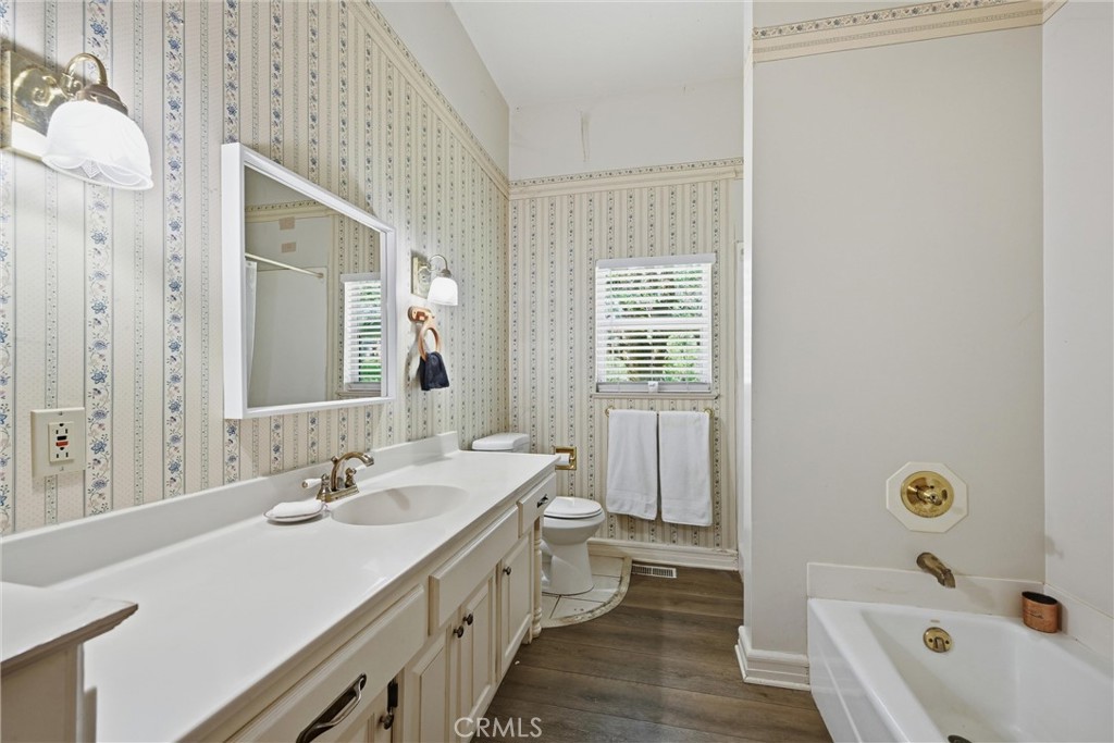 19552 Powder Horn Road Hidden Valley Lake, CA 95467 - Photo 23 of 30 a bathroom with a tub sink and mirror