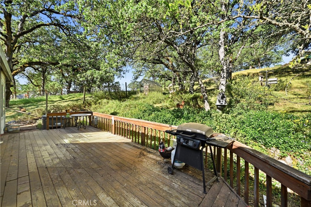 19552 Powder Horn Road Hidden Valley Lake, CA 95467 - Photo 25 of 30 a view of a balcony with wooden floor and bench