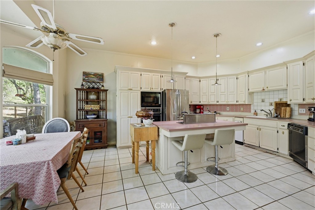 19552 Powder Horn Road Hidden Valley Lake, CA 95467 - Photo 9 of 30 a kitchen with a sink a counter top space appliances and cabinets