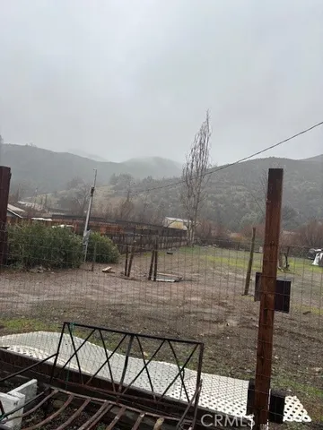 a view of a house with a dry yard