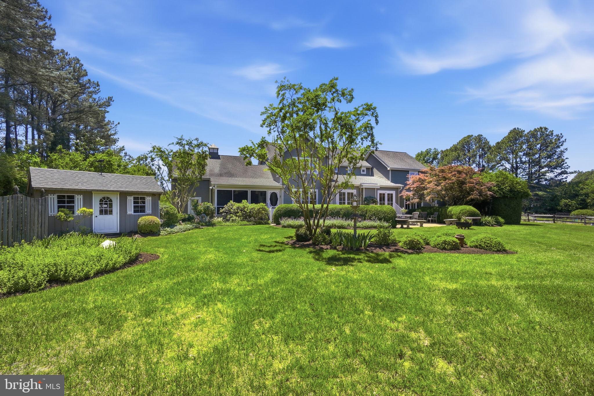 26226 Langs Landing Road Oxford, MD 21654 - Photo 43 of 48 a view of a house with a big yard and large trees