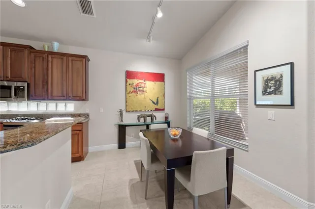 a living room with furniture a rug and a large window