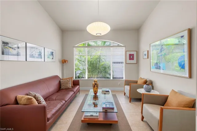 a view of a patio with swimming pool table and chairs